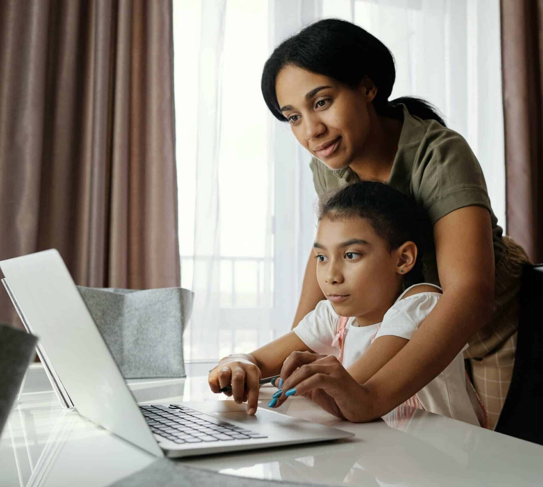 mother helping child with homework
