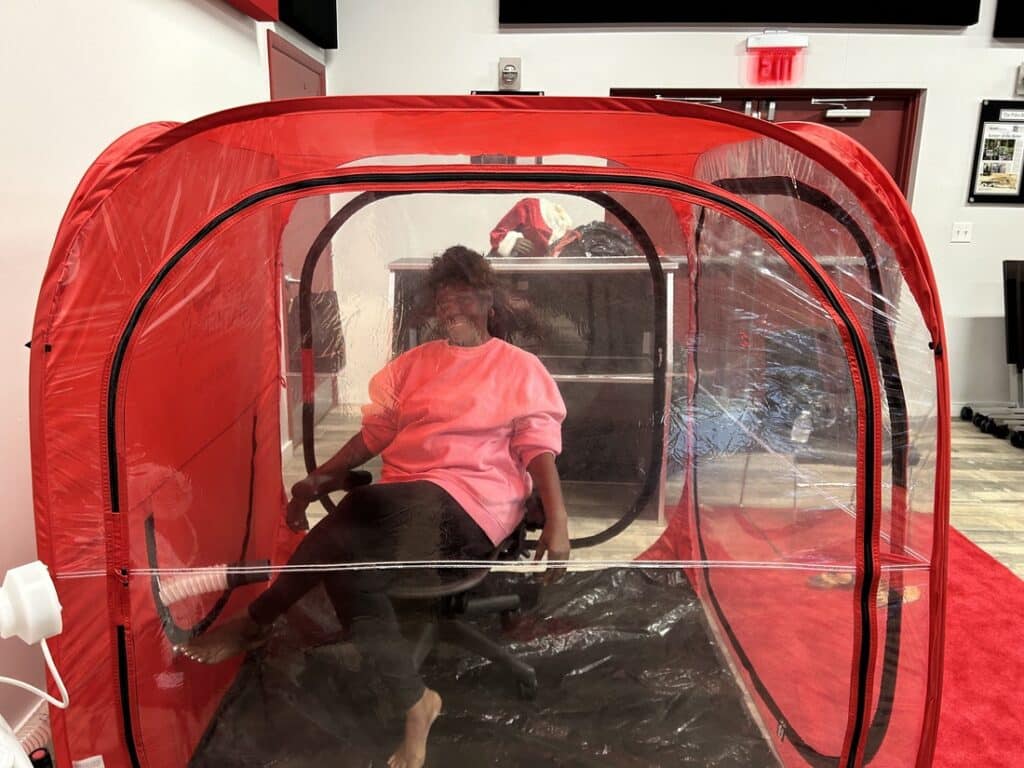 woman doing salt therapy chamber