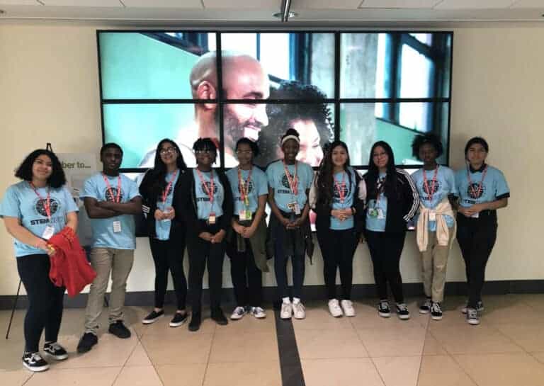 group of students wearing blue shirts
