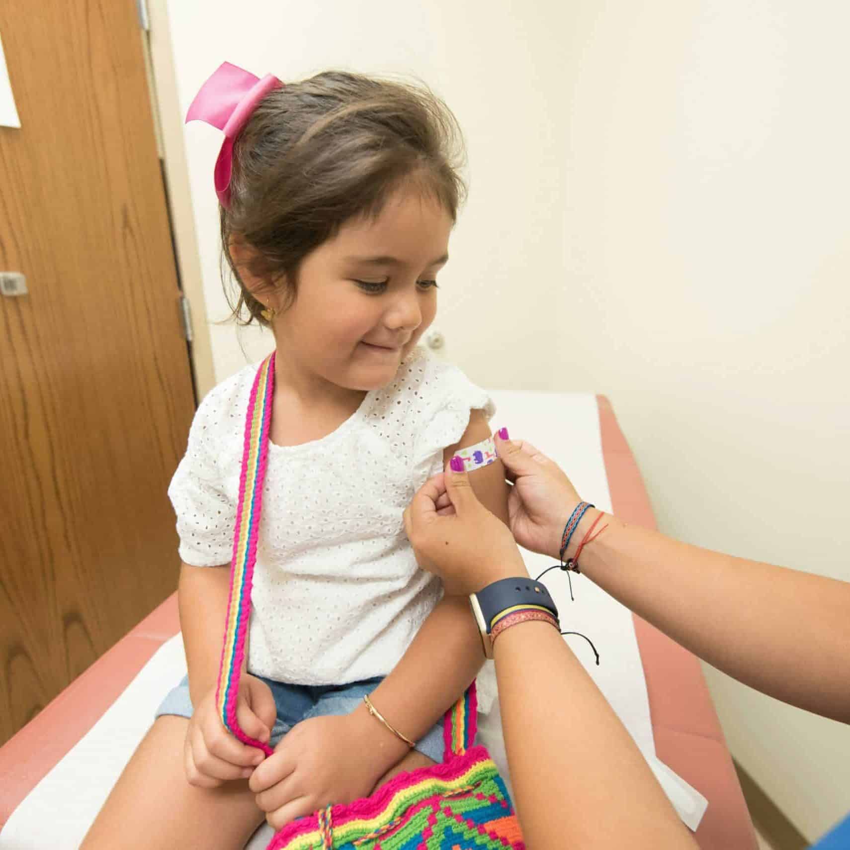 child receiving a vaccine