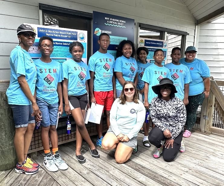 group of young adults wearing blue shirts